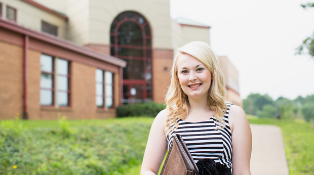 A female student outside of the Zappala Campus Center at La Roche University.